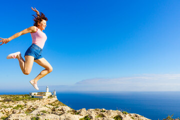 Woman enjoy trip in Spain. Mesa Roldan lighthouse location, Almeria Spain.