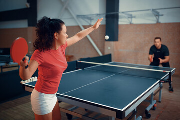 Woman hits the ball, table tennis, ping pong