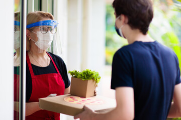 Pizza delivery in lockdown. Take away food.