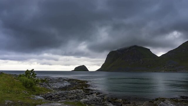 Timelapse of clouds moving over Haukland beach on Lofoten islands in Norway