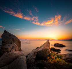 Sunrise or sunset in Greece by the sea. Nice beach photo and landscape. Counter-shot in the morning with great clouds