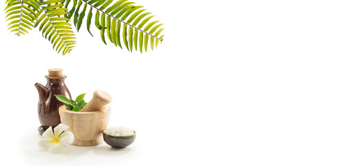 close up view of mortar, salt and oil on white back. 