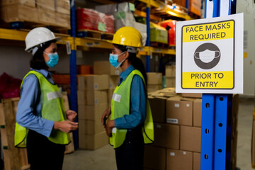 Caution sign in factory warning to industry labor worker to prevent Covid-19 Coronavirus spreading...