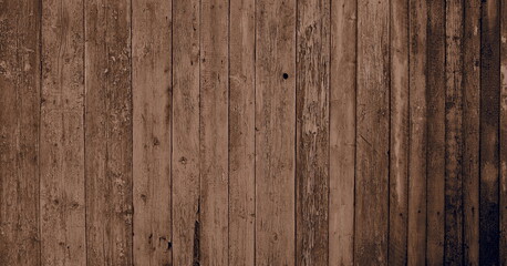 Wooden natural background with light sepia art processing.Fragment of old wooden wall cladding.