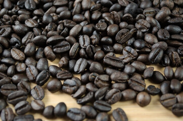 Dark roasted coffee beans close-up. Coffee background