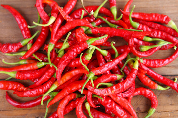 Red pepper on background of wood planks. Chili pepper.