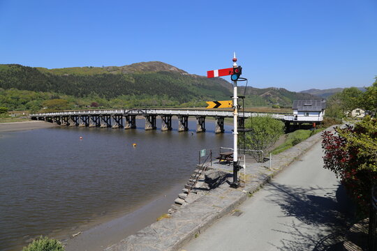 The toll road bridge across Mawddach River at Penmaenpool, Gwynedd, Wales, UK.