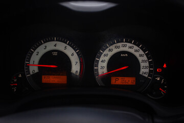 Car​ dashboard​ modern​ automobile control​ illuminated panel​ speed display.