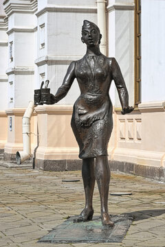 Yekaterinburg, Russia. Sculpture of a conductress with two glasses of tea next to the Old railway station building.