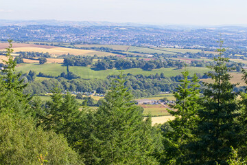 Fototapeta na wymiar A view across Devonish farmland towards Exeter from Haldon Forest, Devon, England, UK.