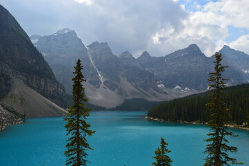 The turquoise Moraine Lake and the waterfalls and nature of the Rocky Mountains in British Columbia, Canada