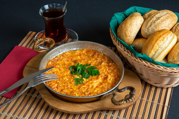 sausage with egg in copper pan turkish meal
