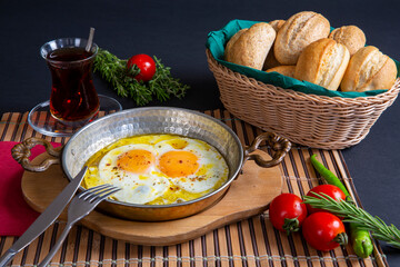 sausage with egg in copper pan turkish meal