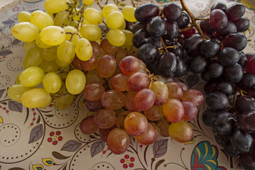 Ripe red grape with leaf isolated on white. With clipping path. Full depth of field.