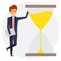 
Office worker businessman standing next to hourglass, punctual businessman concept
