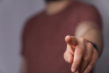 Naklejka premium A man hand touching virtual screen, modern background concept , can put your text at the finger, copy space.
