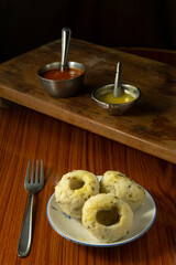 Rice steamed cup dumplings with ghee and chutney