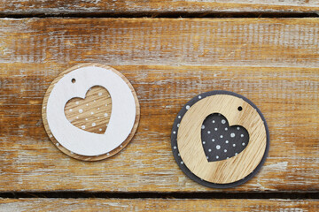 Two hearts on rustic wooden surface with copy space
