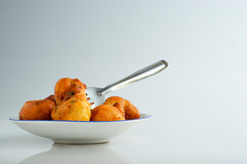 Fresh mysore bonda in a plate on a white background