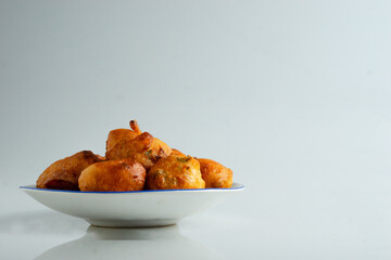 Fresh mysore bonda in a plate on a white background