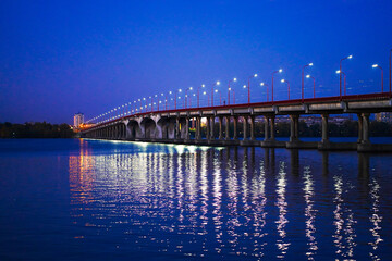 Evening photo, road bridge across a wide river