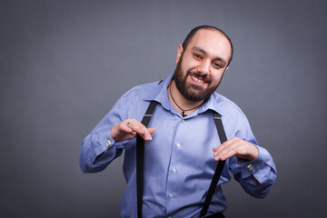 Armenian man in a shirt with a beard on a gray background in the studio