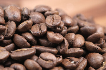 fresh coffee beans on wooden background 