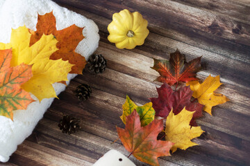 Autumn decoration with leaves, cones, cups, sweaters