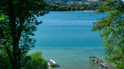 Lake in the summer with boats and pontoon