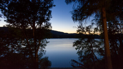 Sunset on a lake with pontoon