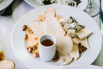 Cheese. Food. Festive table with dishes. Dish. Side view.