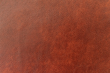 Texture of genuine leather, brown color, background, pattern for backdrop. Manufacturing of leather accessory concept