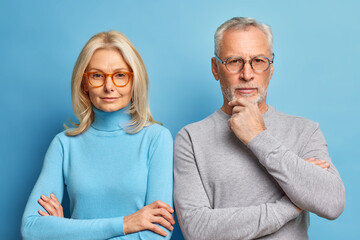Portrait of serious husband and wife pose together in casual clothes make photo for long memory....
