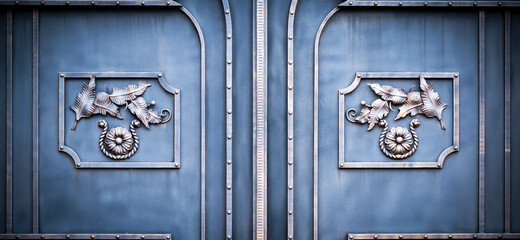 Wrought-iron gates, ornamental forging, forged elements close-up.