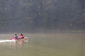 Fototapeta na wymiar Group of girls on a pedal boat