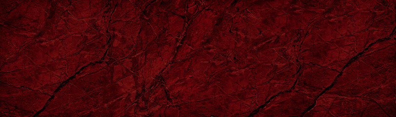 Red black abstract rough background. Toned rock texture with cracks and veins. Dark red stone background.