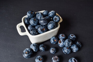 blueberries in a bowl, blueberries on a plate