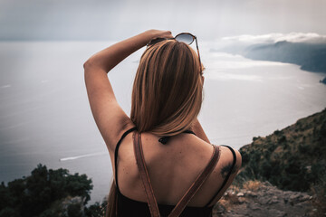 Woman taking landscape pictures