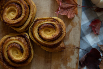 cinnamon rolls on wooden board
