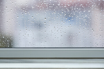 windowsill and Falling rain drops background