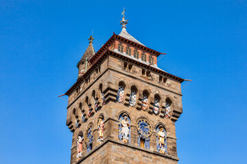 Fototapeta na wymiar The clock tower of Cardiff Castle Wales UK completed in 1873 which is part of the wall of the 12th century Norman fort which is a popular tourism travel destination attraction landmark of the city 