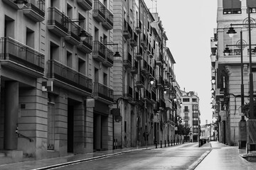 Downtown street view of Alcoi in black and white.