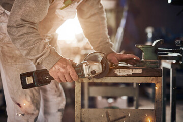 Male carpenter working in a retro vintage workshop.