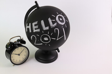Hello 2021 , Happy New Year
Black Globe with Wording " Hello 2021 " , Alarm Clock , Hour Glass , 2 Black Books , White Background