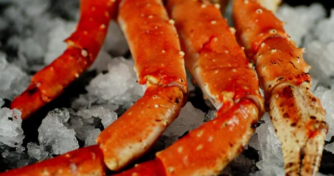 Boiled crab on ice slowly rotates.