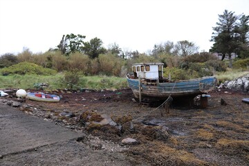 old boat on the river, north uist, hebrides, scotland
