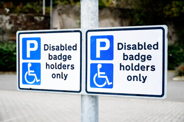 Disabled blue badge holder parking sign for driver 