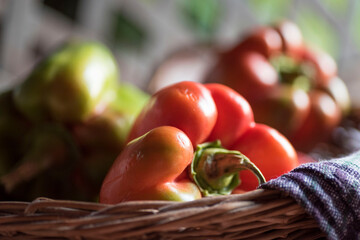 Selective focus shot of bell peppers in a basket