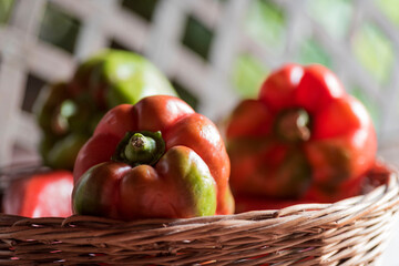 Selective focus shot of bell peppers in a basket