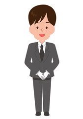 手を前で組んで立つ男性スタッフ